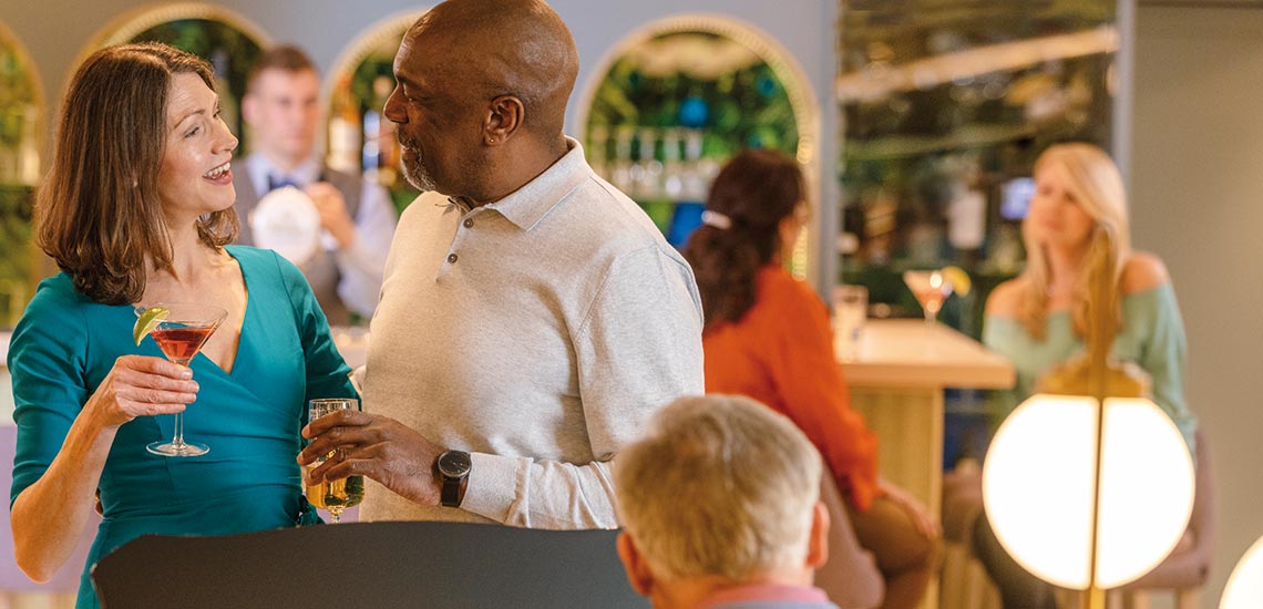 A couple enjoying a drink from the bar aboard Spirit of the Danube
